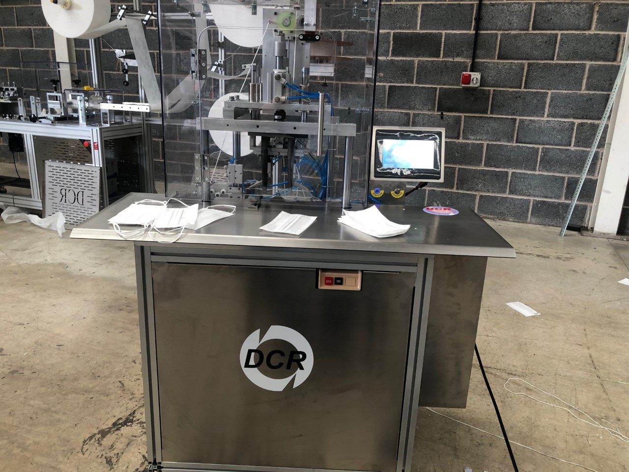 Photo of an DCR-SA2MAM SEMI AUTOMATIC MASK ATTACHING MACHINE Industrial Sewing Machines
