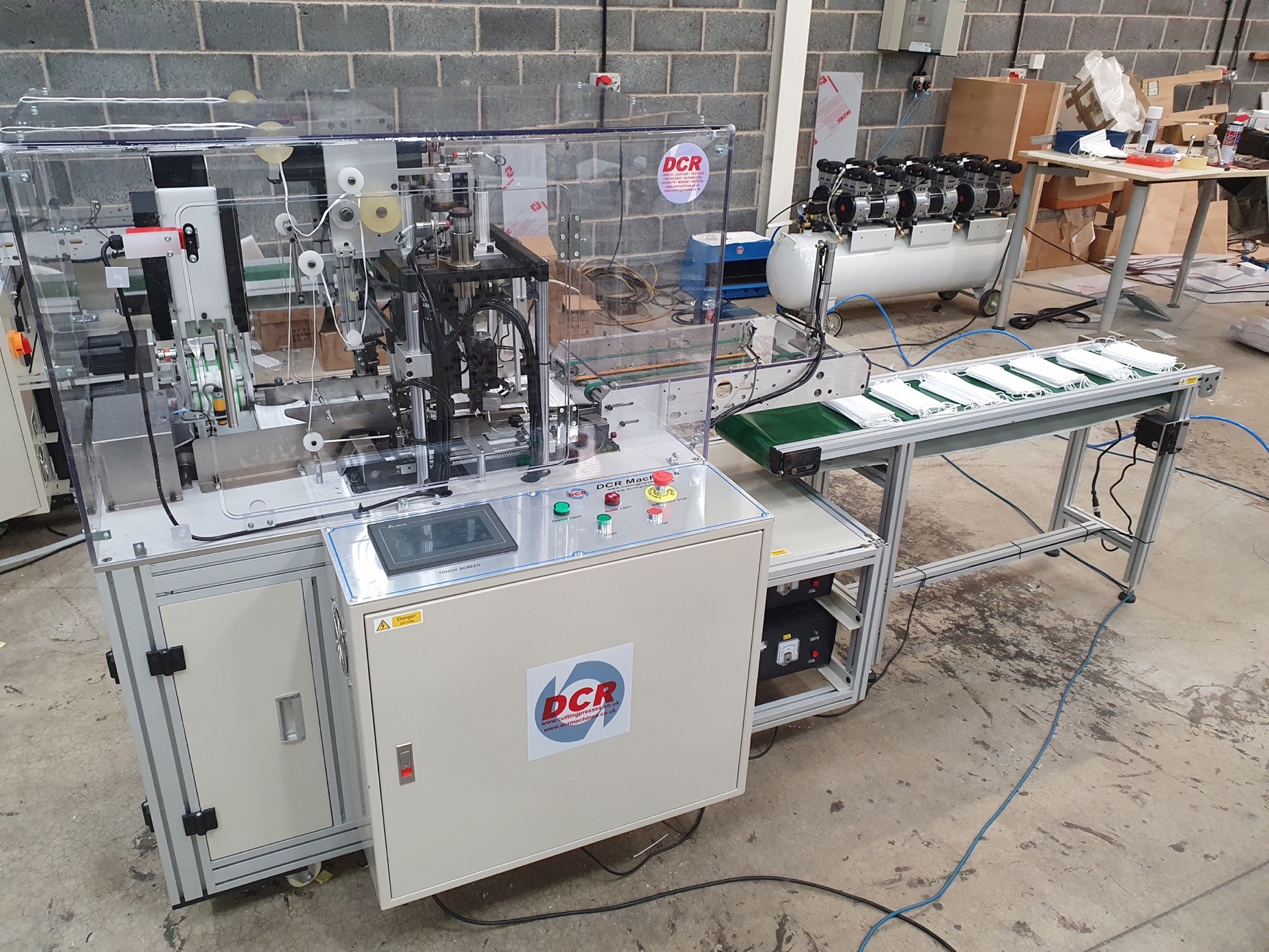 Photo of an DCR-AEL AUTOMATIC EAR LOOP MACHINE Industrial Sewing Machines