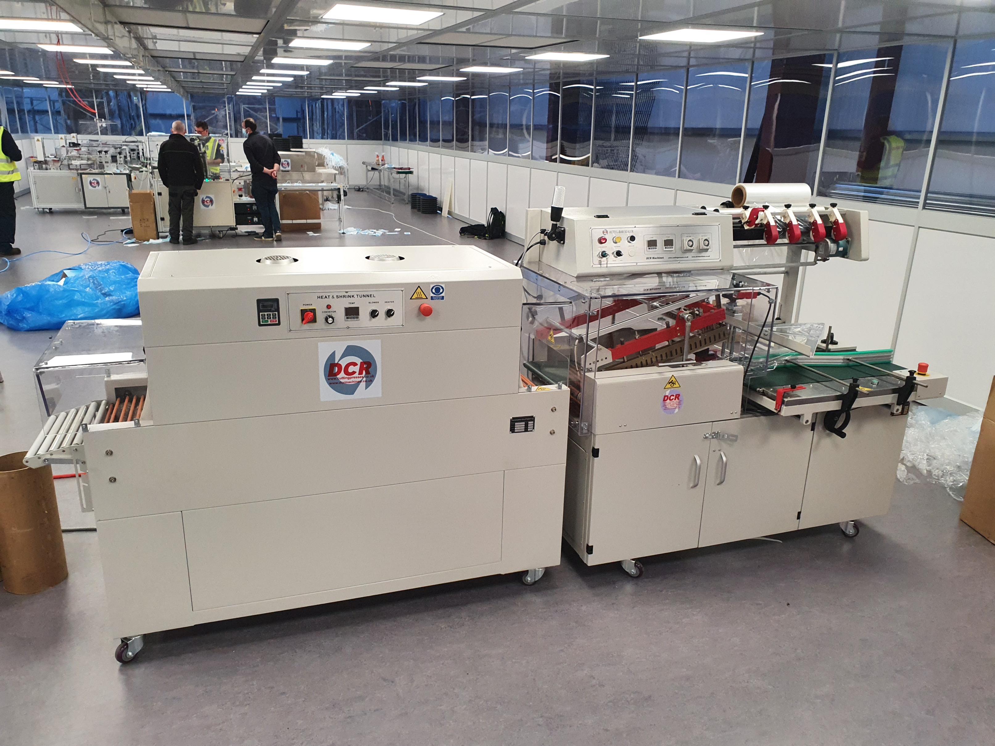 Photo of an DCR-FWM FLOW WRAP MACHINE WITH SHRINK TUNNEL Industrial Sewing Machines